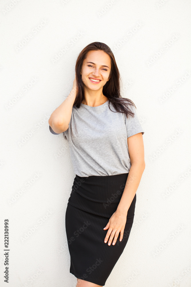 Happy brunette woman in gray t-shirt Happy brunette woman in gray t-shirt