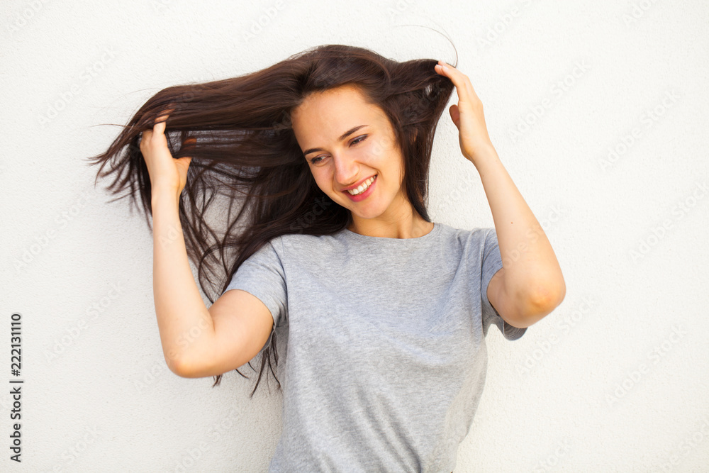 Happy brunette woman in gray t-shirt Happy brunette woman in gray t-shirt