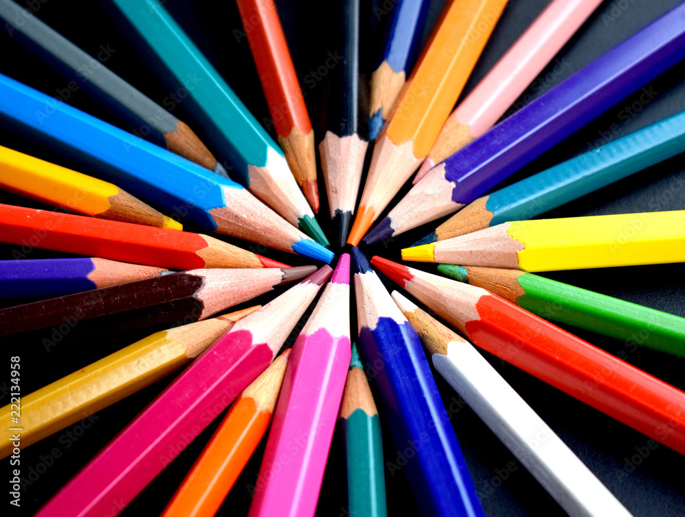 Colored pencils on black background Colored pencils on black background