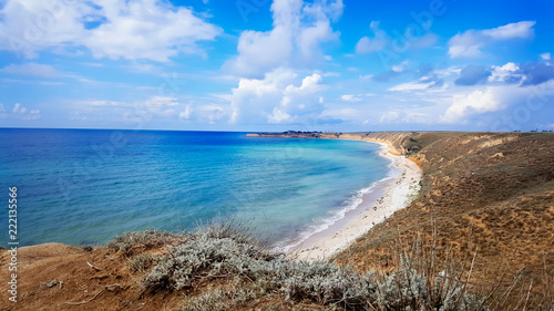 Panorama view of beautiful deserted beach in a sunny day. Western coast of Crimea.