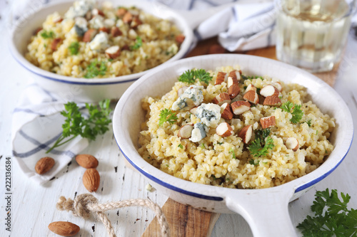 Bulgur cereal risotto with blue cheese, parsley and almonds