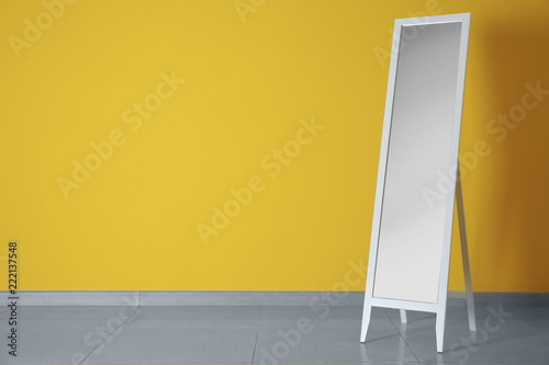 Large mirror near color wall