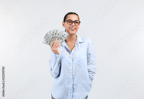 Happy young woman with doll...