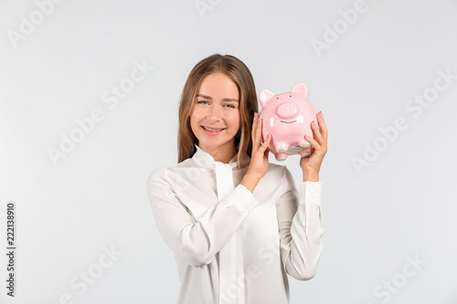 Happy young woman with pigg...