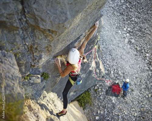 Austria, Innsbruck, Martinswand, woman climbing in rock wall