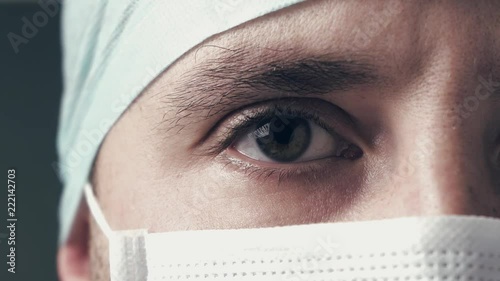 Portrait of a physician or surgeon who looks proud room, happy and smiling for his work in the clinic or hospital. Concept: doctor, patient care, coronavirus corvid 19 quarantine.