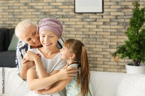 Woman after chemotherapy with her family at home