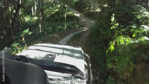 POV 4x4 driving jeep vehicle Wilderness safari mountain forest dirt road Chiangmai Thailand