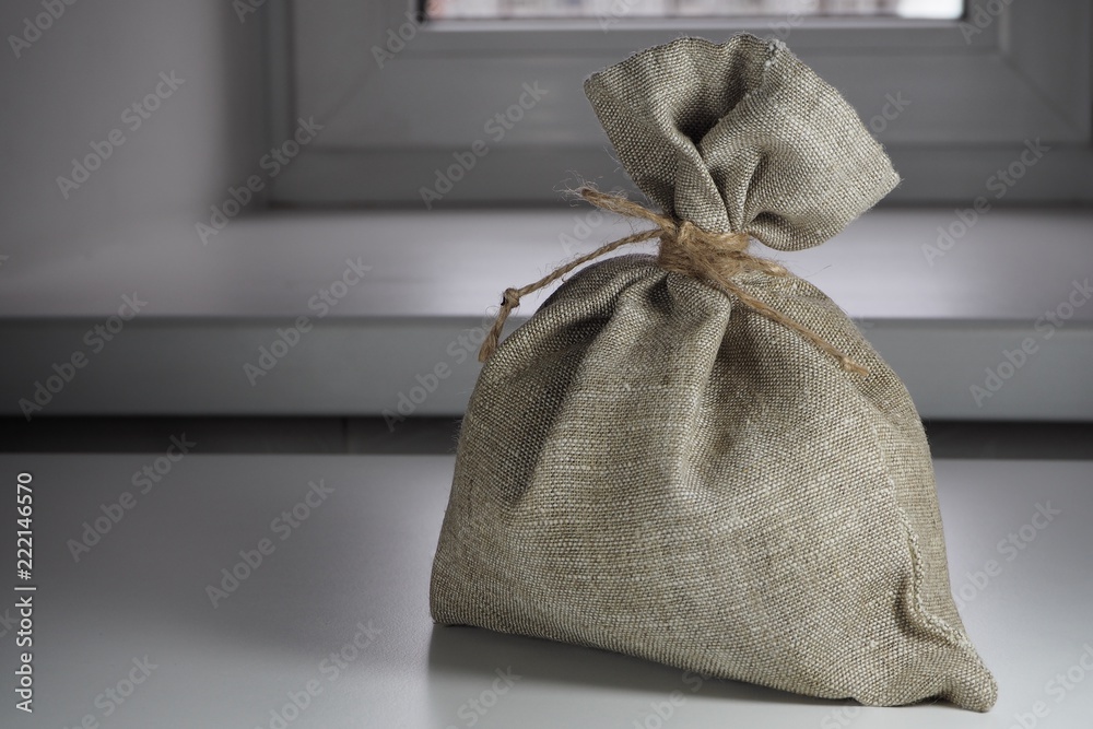 small sackcloth bag knotted with jute twine small sackcloth bag knotted with jute twine