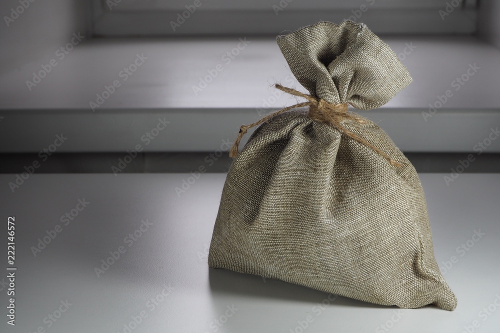 small sackcloth bag knotted with jute twine small sackcloth bag knotted with jute twine