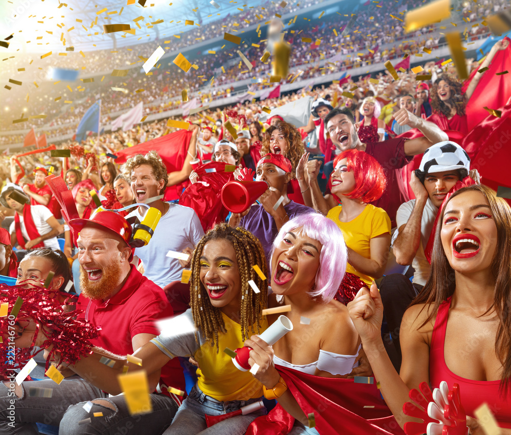 Young sport supporter happy cheering at stadium. Group of young woman and man support the football team during the match Stock Photo | Adobe Stock