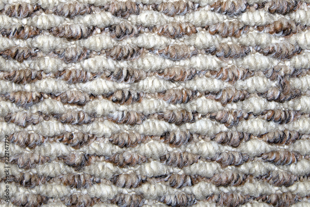Beige and white synthetic floor carpet covering with wavy geometric pattern, may be used as background or texture Beige and white synthetic floor carpet covering with wavy geometric pattern, may be used as background or texture