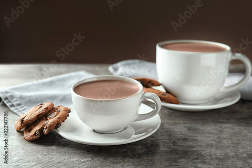 Two white mugs of hot choco...