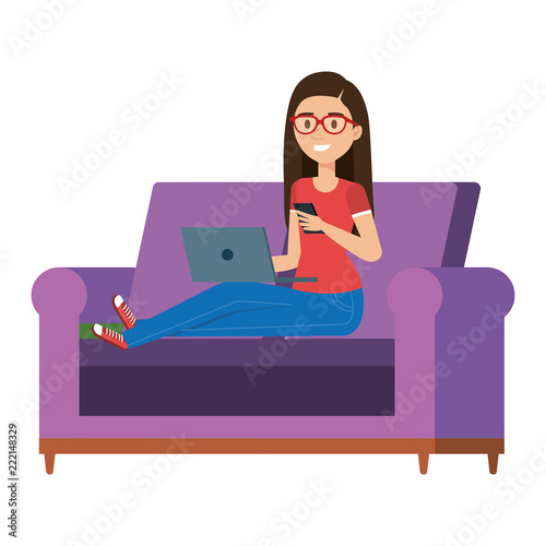 young woman at sofa with laptop and smartphone