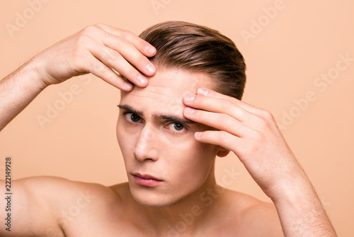 Portrait of upset, frustrated, naked brown-haired man looking fo