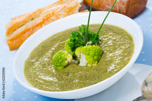 Cheese cream-soup from broccoli with soft cheese and bread, traditional dish