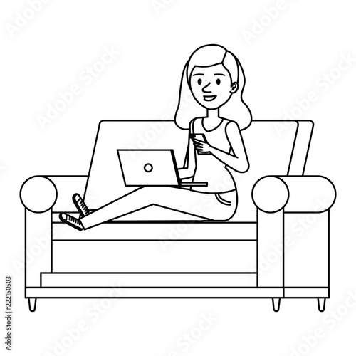 young woman at sofa with laptop and smartphone