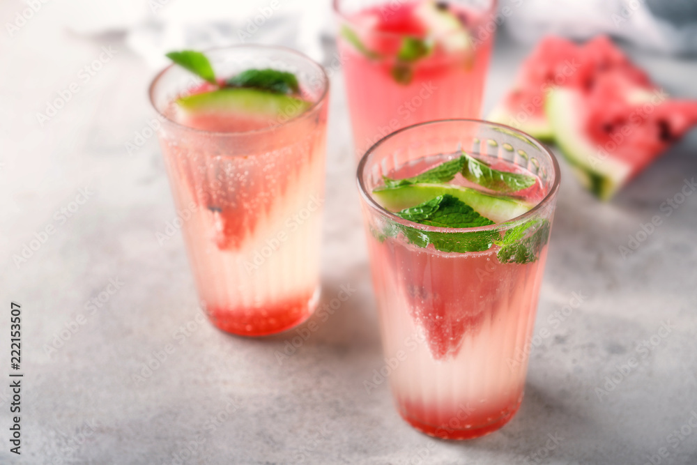 Fresh summer cocktail in glasses on light table Fresh summer cocktail in glasses on light table