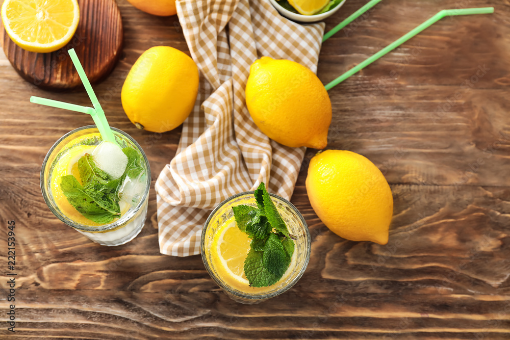 Glasses of fresh lemonade on wooden table Glasses of fresh lemonade on wooden table
