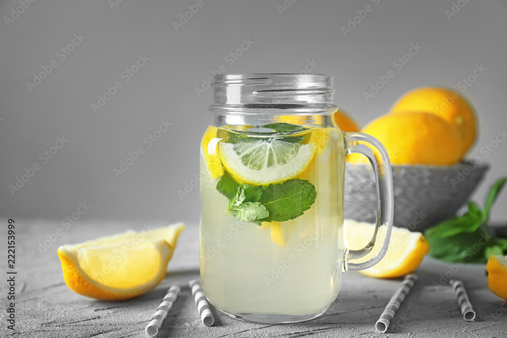 Mason jar of fresh lemonade on table Mason jar of fresh lemonade on table