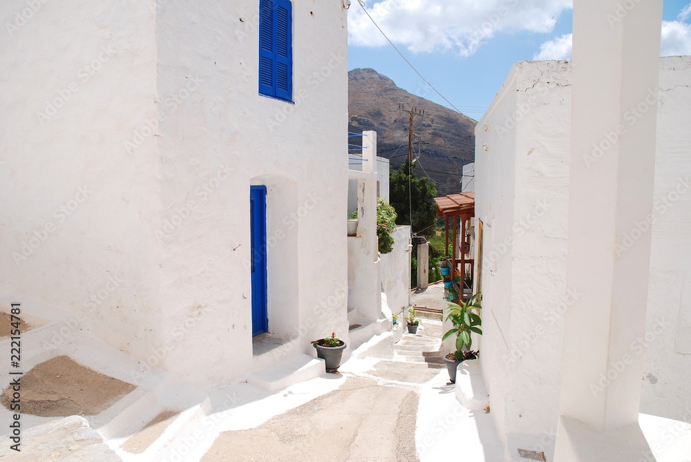 Naklejka premium The whitewashed buildings of Megalo Chorio on the Greek island of Tilos. The village is the Capital of the island which has a population of around 780 people.