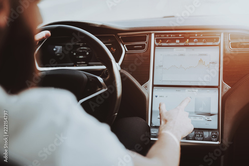 Obraz na płótnie Man In A Tesla Car. Behind The Wheel Concept. w salonie