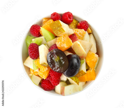 Delicious fruit salad in bowl on white background