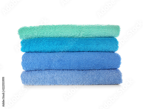 Stack of clean soft towels on white background