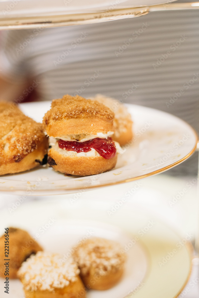 Scones with Strawberry Champagne Jam and Clotted Cream, Traditional English Tea Ceremony in Luxury Hotel Scones with Strawberry Champagne Jam and Clotted Cream, Traditional English Tea Ceremony in Luxury Hotel