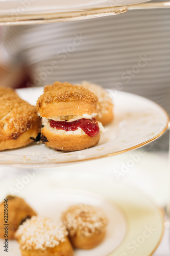 Scones with Strawberry Champagne Jam and Clotted Cream, Traditional English Tea Ceremony in Luxury Hotel