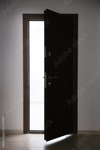 фотографія View of ajar wooden door