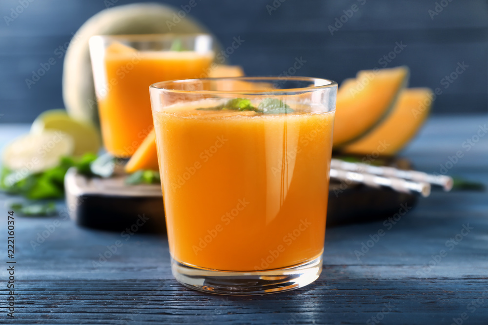 Glass of tasty melon smoothie on table Glass of tasty melon smoothie on table
