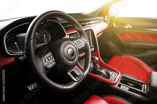Car interior steering wheel partial close-up © jeson