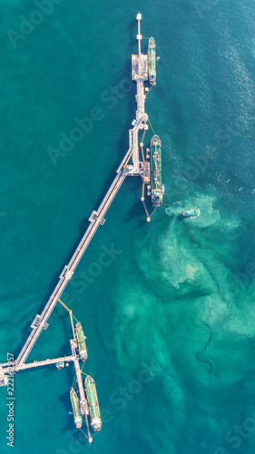 oil tanker, gas tanker in the high sea.Refinery Industry cargo ship,aerial view,Thailand, in import export, LPG,oil refinery, Logistics and transportation with working crane bridge in harbor