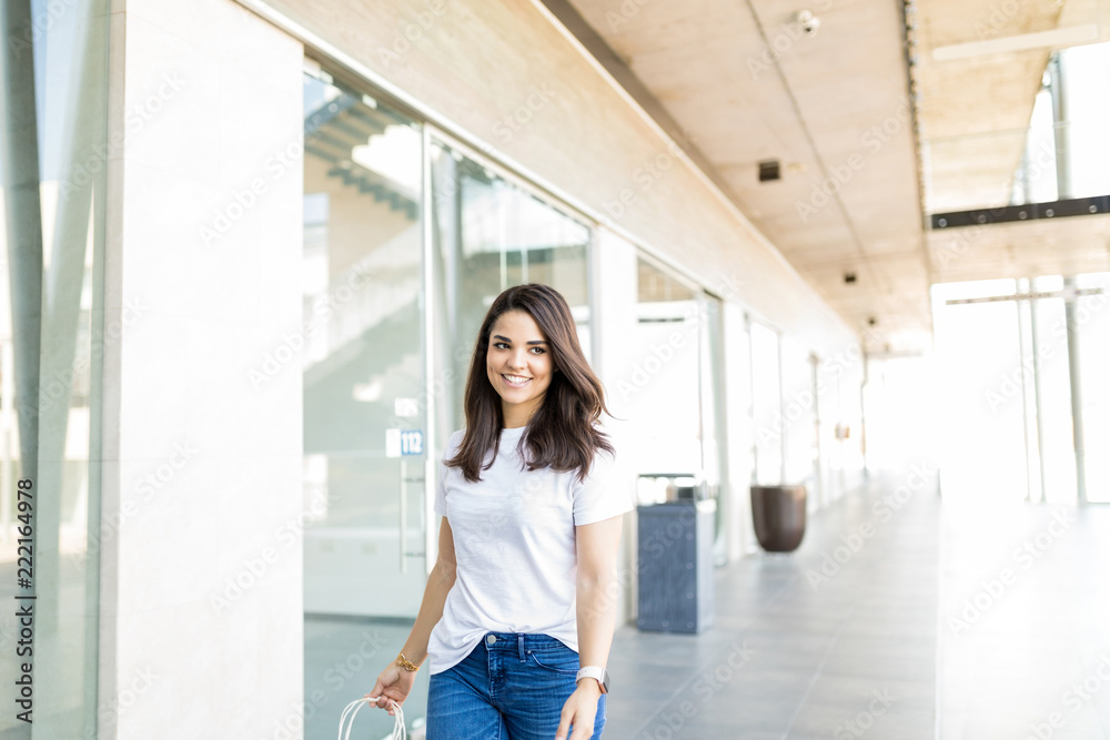 Beautiful Woman Smiling While Walking In Shopping Mall Beautiful Woman Smiling While Walking In Shopping Mall