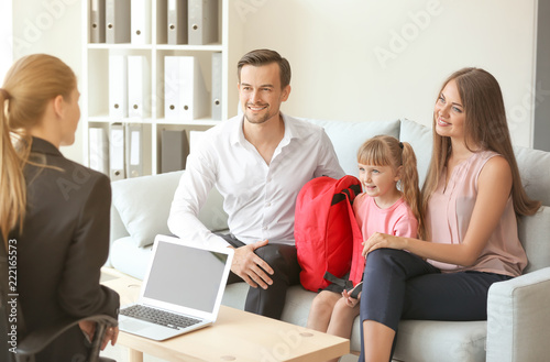 Young couple and their daug...