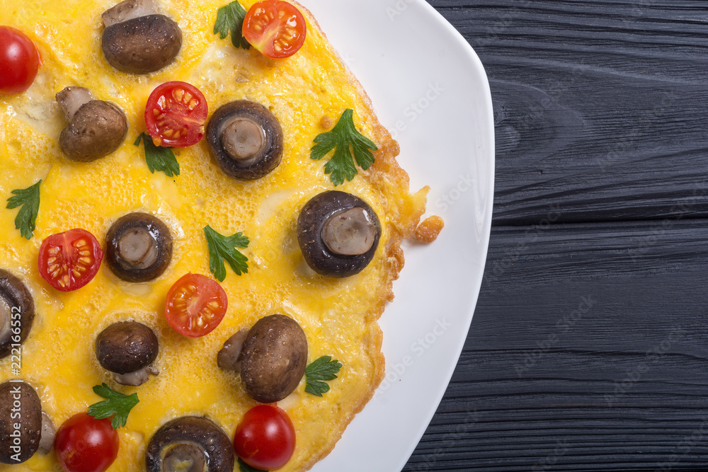 Omelette with mushroom , tomato and parsley Omelette with mushroom , tomato and parsley