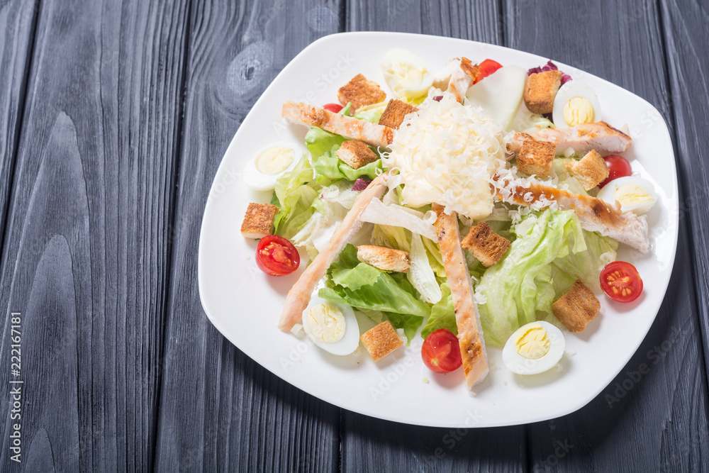 Salad ceasar with chicken , eggs and tomatoes Salad ceasar with chicken , eggs and tomatoes