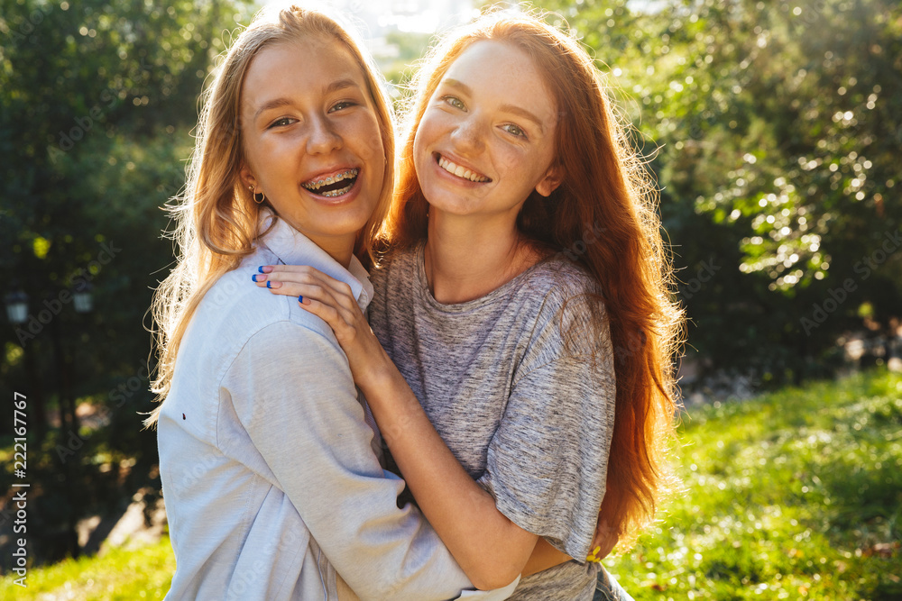 Fototapeta premium Two happy youg girls having fun