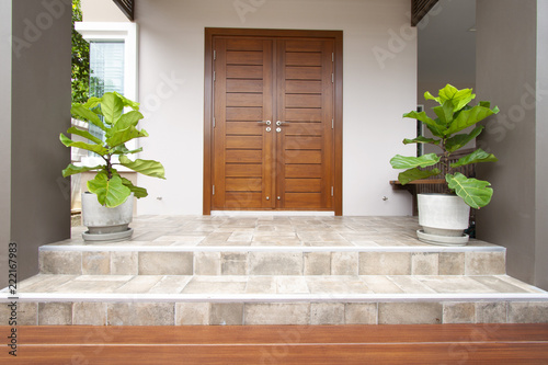Canvas Print Main entrance of residential house with tiled floor and steps