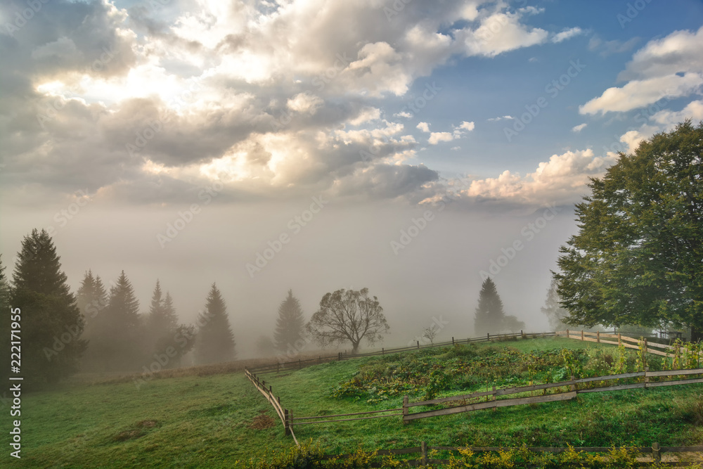 Foggy Dawn in a Mountain Village in Ukrainian Carpathians