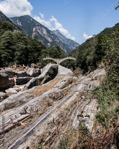 View in Valle Verzasca, famous Swiss Location with double arch stone bridge at Ponte dei Salti with waterfall, Lavertezzo, Verzascatal, Canton Tessin – Tecino photo