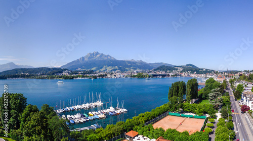 view from the air to houses and roads, tennis court club, summer day. traffic, concept of holidays and vacations, travel to Europe part of Luzern, Switzerland
