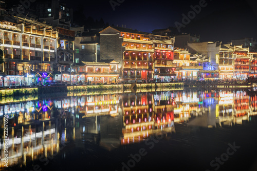 Colorful Chinese buildings reflected in water, Fenghuang