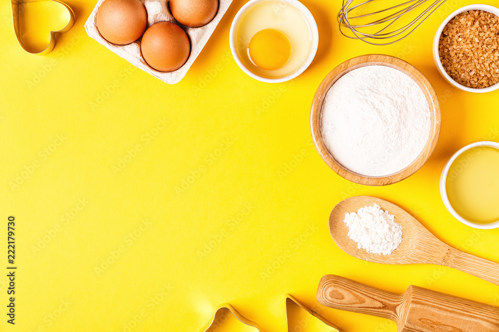 Ingredients and utensils for baking on a pastel background.
