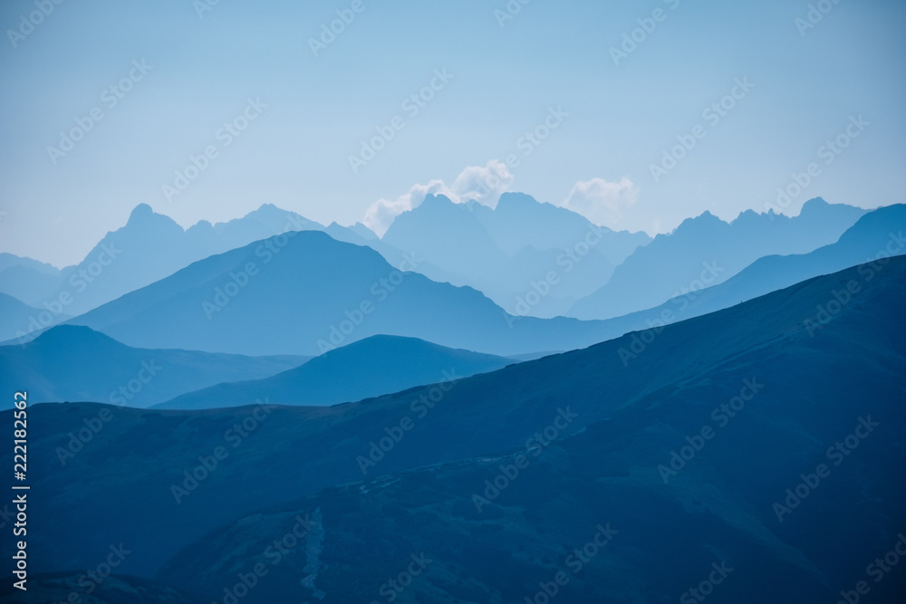 mountain top panorama in  autumn covered in mist or clouds