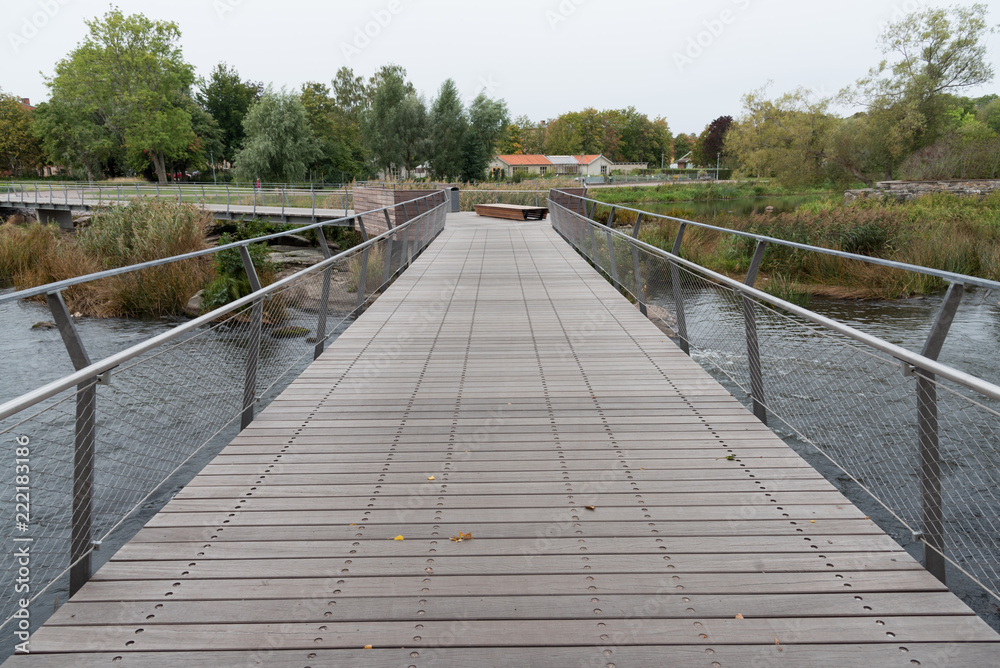 wooden bridge over the river Tidan in Mariestad city center