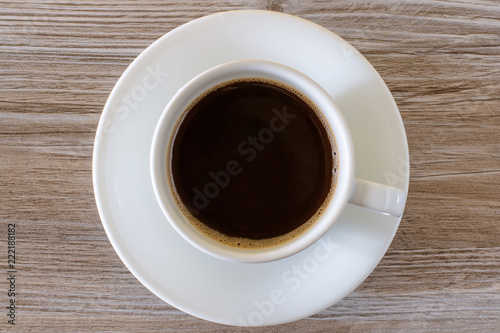 cup of coffee on wooden background