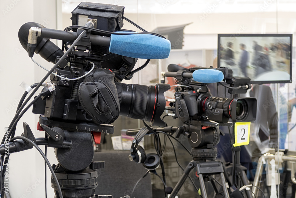 Professiona tv camera in live show pavilion. Professiona tv camera in live show pavilion.