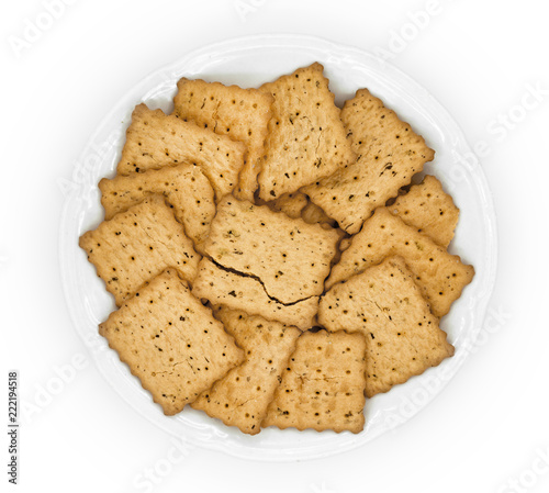 crackers in plate on white